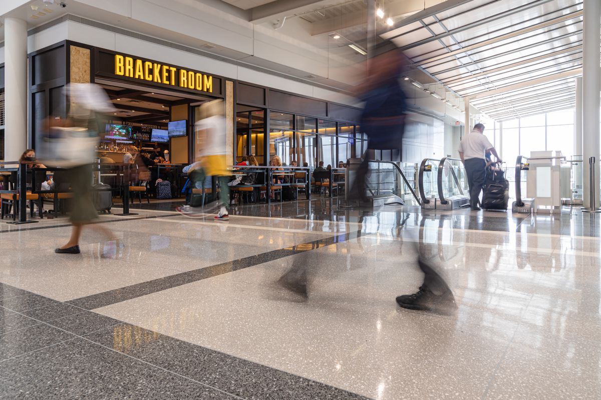 A photo of Bracket Room’s signage and passengers whizzing by.