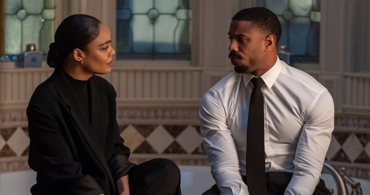 Bianca (Tessa Thompson) and Adonis (Michael B. Jordan) sit on the edge of a bathtub in formalwear, in one of several tense, frustrating conversations in Creed III