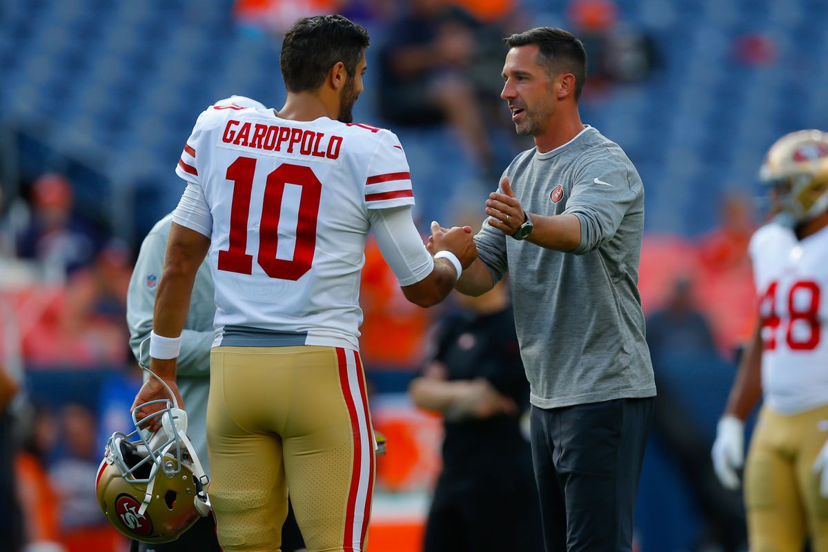 Quarterback Jimmy Garoppolo and head coach Kyle Shanahan of the San Francisco 49ers shake hands before a preseason game against the Denver Broncos at Broncos Stadium at Mile High on August 19, 2019 in Denver, Colorado.