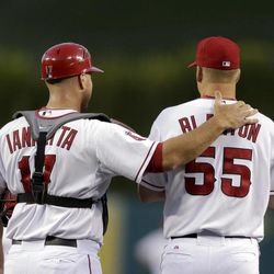 Los Angeles Angels catcher Chris Iannetta, left, talks to starting pitcher Joe Blanton during the first inning of a baseball game against the Texas Rangers in Anaheim, Calif., Monday, April 22, 2013. 