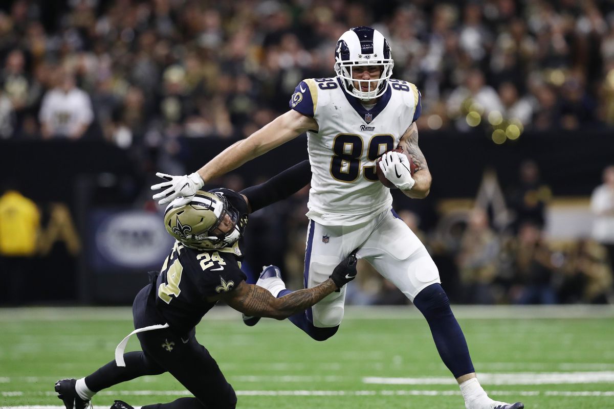 Los Angeles Rams TE Tyler Higbee gets away from New Orleans Saints S Vonn Bell during overtime in the NFC Championship, Jan. 20, 2019.