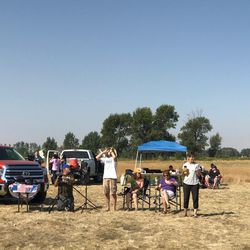 A crowd of eclipse enthusiasts await the natural phenomenon to unfold in Rigby, Idaho, on Monday, Aug. 21, 2017.