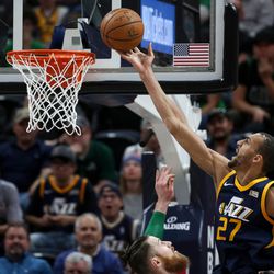 /Utah Jazz center Rudy Gobert (27) goes to the hoop over Boston Celtics center Aron Baynes (46) at Vivint Smart Home Arena in Salt Lake City on Wednesday, March 28, 2018.