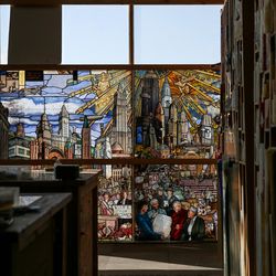 Panels of art glass that will make up "The Roots of Knowledge," a 200-foot-long stained glass installation for Utah Valley University, hang in the window at Holdman Studios in Lehi, Utah, on Nov. 4, 2016. 
