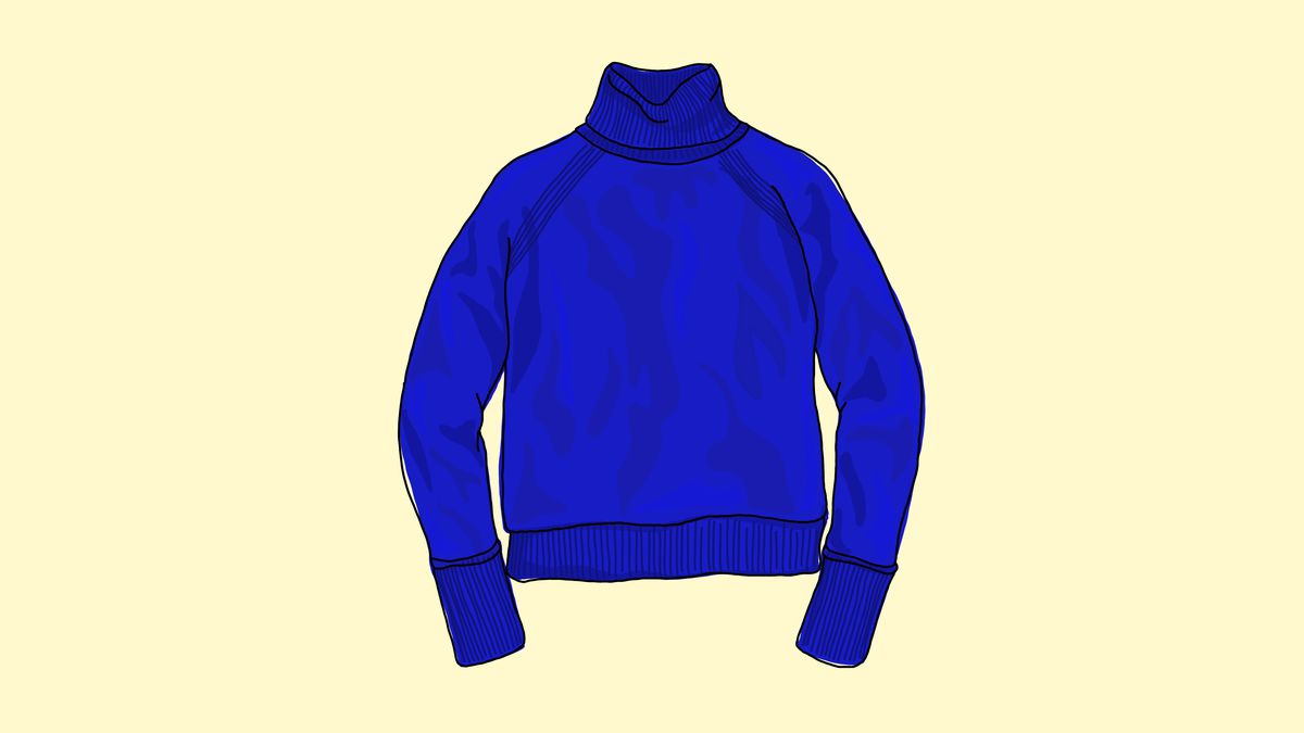 A blue sweater against a cream background.
