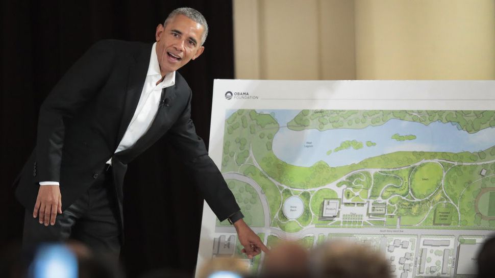 Former President Barack Obama points out features of the proposed Obama Presidential Center in May. | Scott Olson/Getty Images