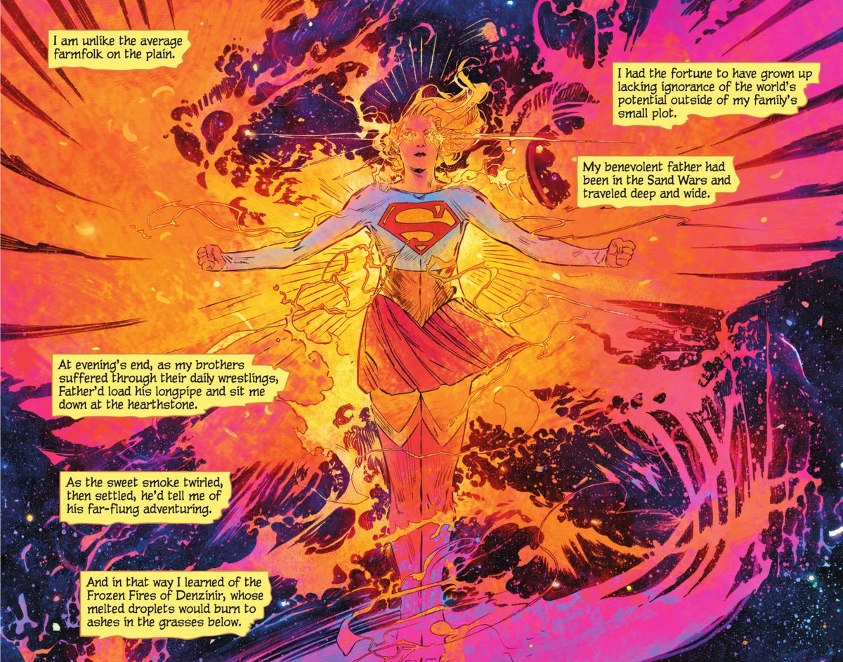 Supergirl floats in space, arms flexed, wreathed in magenta, orange, and yellow flames in the shape of phoenix wings, fire glowing from her eyes like stars in Supergirl: Woman of Tomorrow #2 (2021).