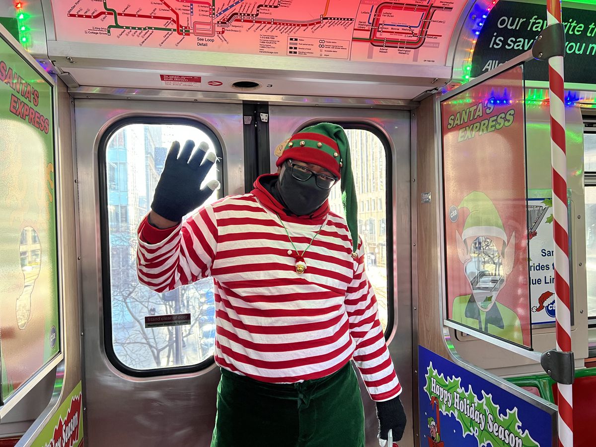 Torrey Price, a CTA worker on the holiday train, wears his festive gear on the holiday train as it circles the Loop Dec. 20.