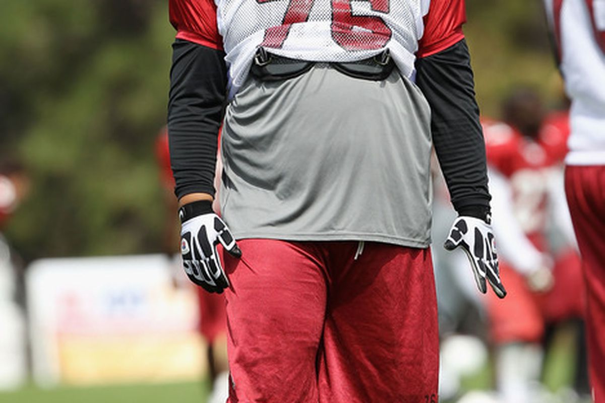 FLAGSTAFF, AZ - AUGUST 04:  Guard Deuce Lutui #76 of the Arizona Cardinals practices during the team training camp at Northern Arizona University on August 4, 2011 in Flagstaff, Arizona.  (Photo by Christian Petersen/Getty Images)
