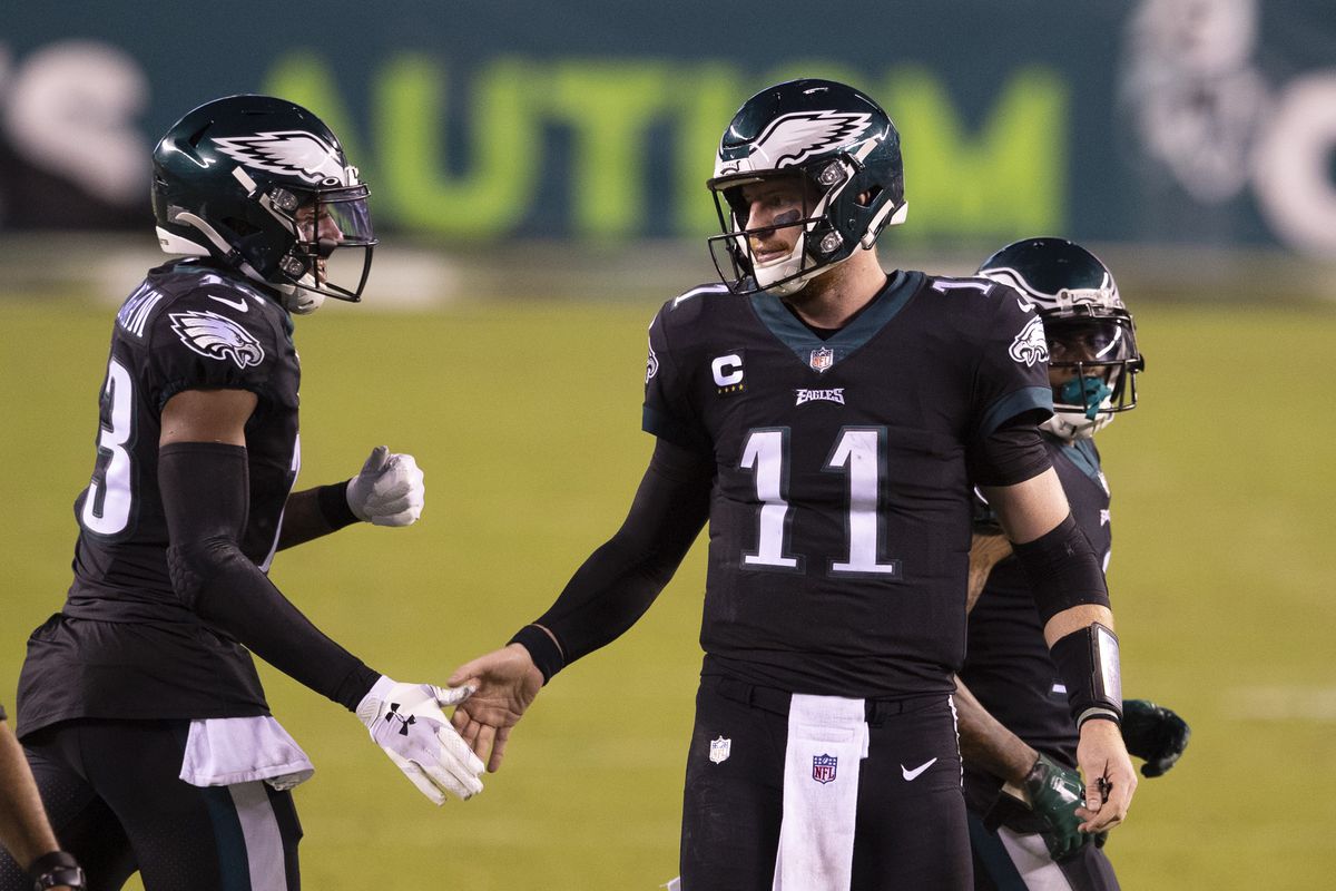 Travis Fulgham and Carson Wentz of the Philadelphia Eagles react against the New York Giants at Lincoln Financial Field on October 22, 2020 in Philadelphia, Pennsylvania.