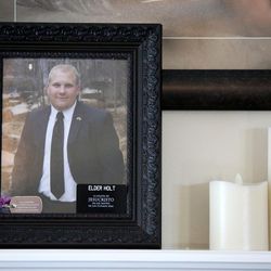 A photo of Josh Holt, who has been held in a Venezuelan prison for one year, sits on the mantle at his parent's home in Riverton on Friday, June 30, 2017.