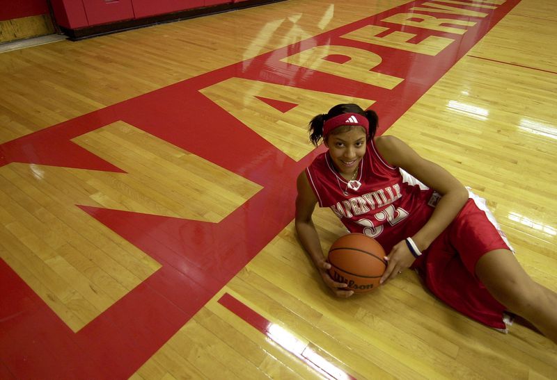 Candace Parker poses in the Naperville Central gym in 2003. High School, is seen in the gym in 2003.