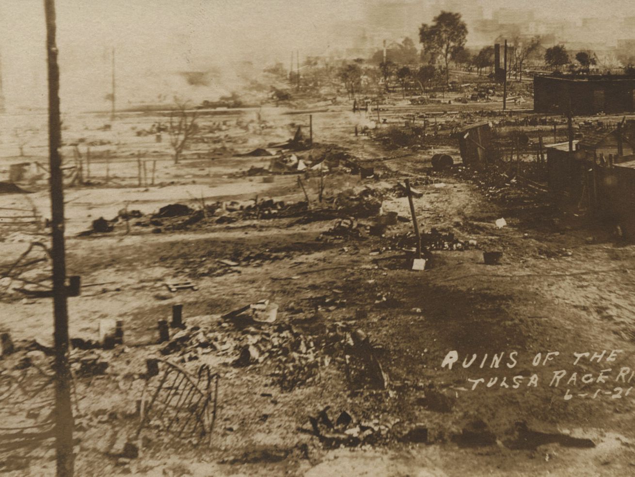 This photo provided by the Department of Special Collections, McFarlin Library, The University of Tulsa shows the ruins of Dunbar Elementary School and the Masonic Hall in the aftermath of the June 1, 1921, Tulsa Race Massacre in Tulsa, Okla. 