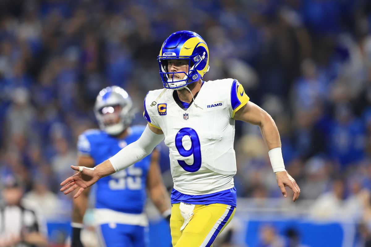 Matthew Stafford #9 of the Los Angeles Rams celebrates after throwing the ball for a touchdown during the second quarter against the Detroit Lions in the NFC Wild Card Playoffs at Ford Field on January 14, 2024 in Detroit, Michigan.