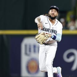 SEATTLE, WASHINGTON - SEPTEMBER 13: J.P. Crawford #3 of the Seattle Mariners throws to first base during the third inning against the San Diego Padres at T-Mobile Park on September 13, 2022 in Seattle, Washington.