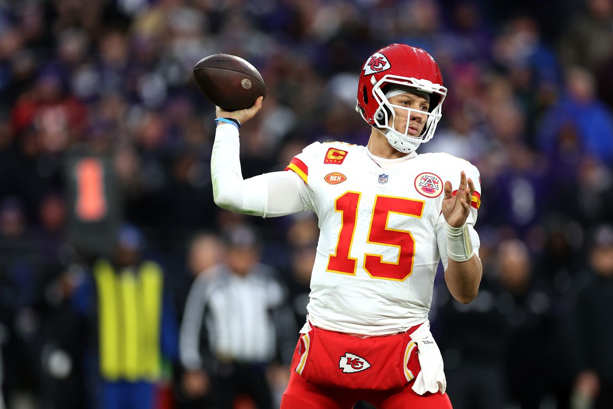 Patrick Mahomes #15 of the Kansas City Chiefs rolls out to pass against the Baltimore Ravens in the AFC Championship Game at M&amp;T Bank Stadium on January 28, 2024 in Baltimore, Maryland.