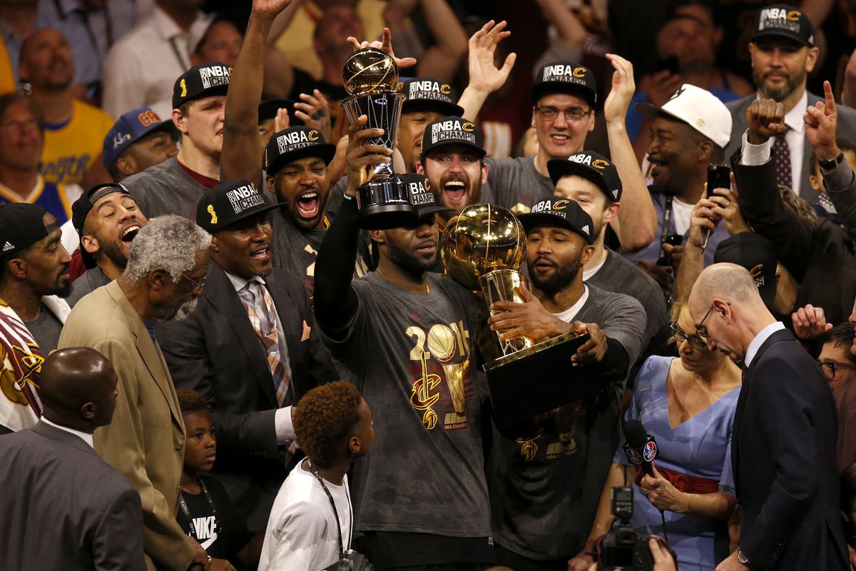 Cleveland Cavaliers’ LeBron James (23) holds the Larry O’Brien Championship Trophy and the MVP trophy after the Cavaliers beat the Golden State Warriors in Game 7 93-89 to win the NBA Finals at Oracle Arena in Oakland, Calif., on Sunday, June 19, 2016. (N