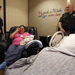 Mariah Ostler meets Brittney Chugg, the 911 dispatcher who answered Ostler's call for help when she realized she was about to deliver her baby on the freeway, during a press conference at Brigham City Community Hospital in Brigham City Sunday, Feb. 1, 2015.