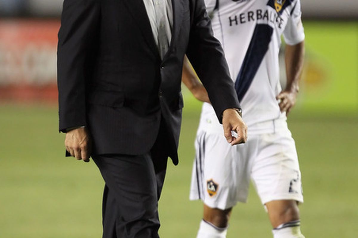 Is Bruce Arena hanging his head about their number three ranking or just walking away from it all? (Photo by Jeff Gross/Getty Images)