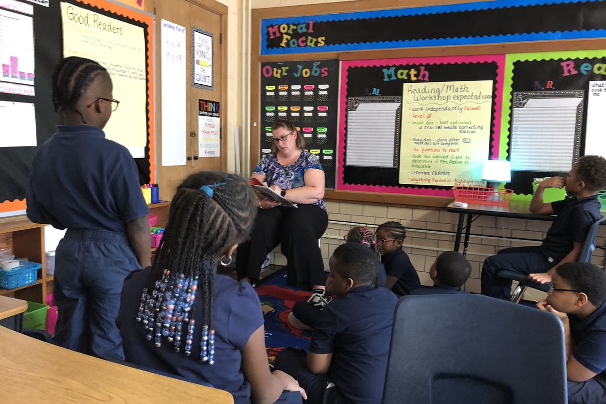 Students in a classroom for advanced readers at Detroit Premier Academy listened to a teacher read a story that contained words like "thesaurus."