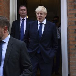 Conservative Party leadership contender Boris Johnson, right, leaves his office in London, Monday July 22, 2019.  Voting closes Monday in the ballot to elect Britain's next prime minister, from the two contenders Jeremy Hunt and Boris Johnson, as critics of likely winner Boris Johnson condemned his vow to take Britain out of the European Union with or without a Brexit deal.(Kirsty O'Connor/PA via AP)