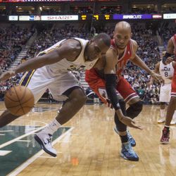 Utah's Paul Millsap fights to regain possession of the ball with Chicago's Taj Gibson as the Jazz and the Bulls play Friday, Feb. 8, 2013 at Energy Solutions arena. Chicago won 93-89.