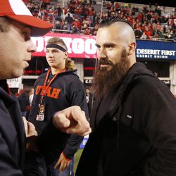 Former Ute Eric Weddle talks with coach Morgan Scalley prior to Pac12 action in Salt Lake City  Saturday, Nov. 8, 2014. 
