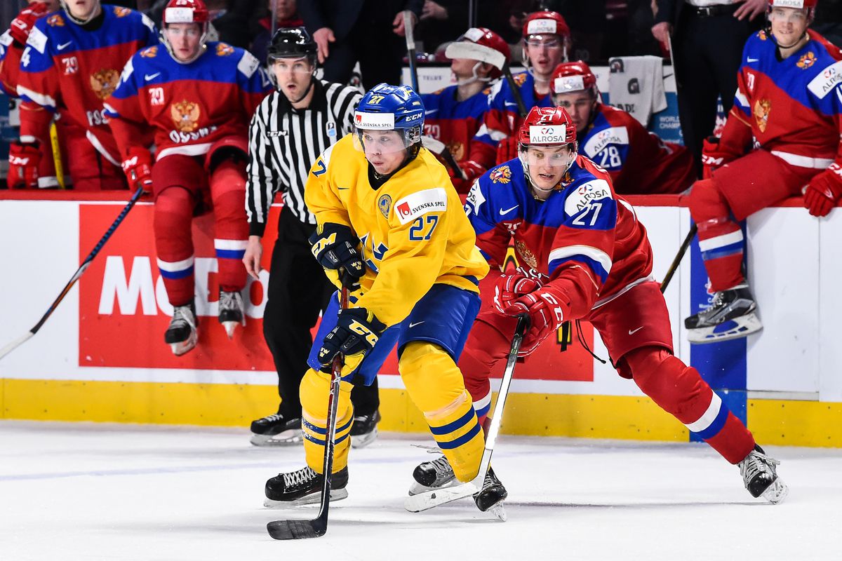 MONTREAL, QC - JANUARY 05: Jonathan Dahlen #27 of Team Sweden skates against Denis Guryanov #27 of Team Russia during the 2017 IIHF World Junior Championship bronze medal game at the Bell Centre on January 5, 2017 in Montreal, Quebec, Canada. Team Russia 