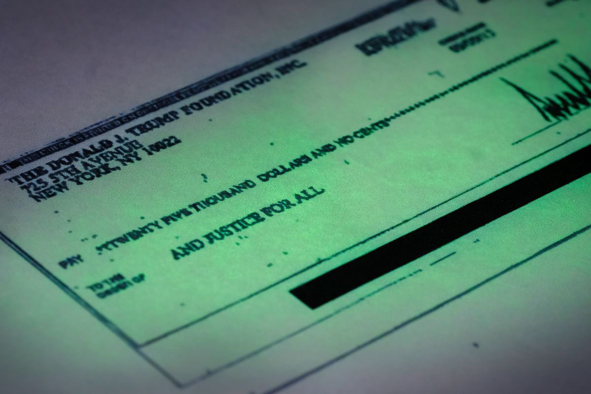 This photo shows a copy of a check provided by the New York state attorney general that shows a payment of $25,000 from the Donald J. Trump Foundation to And Justice For All signed by Donald J. Trump. | J. David Ake/AP