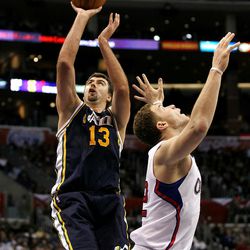 LOS ANGELES, CA - DECEMBER 29:  Mehmet Okur #13 of the Utah Jazz shoots over Blake Griffin #32 of the Los Angeles Clippers at Staples Center on December 29, 2010 in Los Angeles, California.   The Jazz won 103-85.  NOTE TO USER: User expressly acknowledges and agrees that, by downloading and or using this photograph, User is consenting to the terms and conditions of the Getty Images License Agreement.  (Photo by Stephen Dunn/Getty Images)