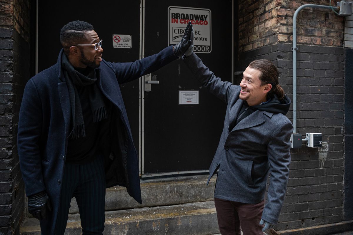 “Hamilton” stars Akron Watson (left) and Miguel Cervantes walk out of the CIBC Theater stage door as the acclaimed musical prepares to wrap up presentations in Chicago. | Santiago Covarrubias/For the Sun-Times