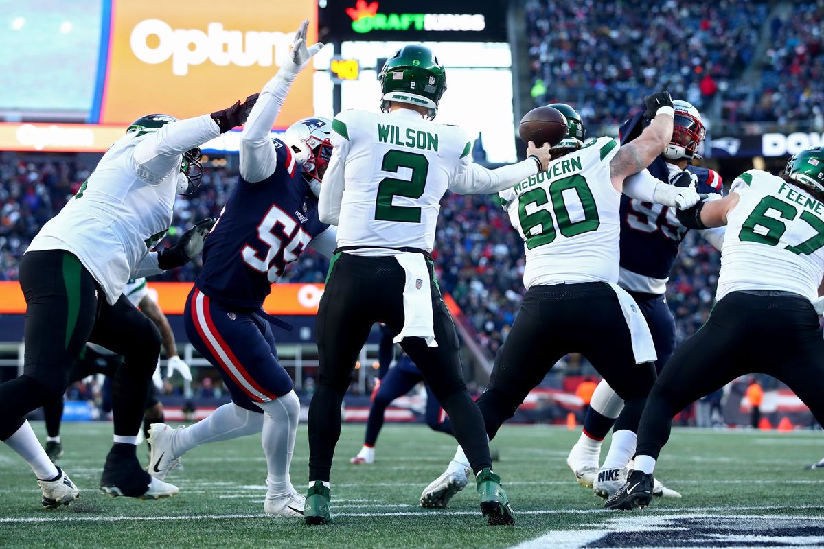 Zach Wilson #2 of the New York Jets throws a pass against the New England Patriots during the second half at Gillette Stadium on November 20, 2022 in Foxborough, Massachusetts.
