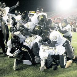 The Desert Hills Thunder rush the field after defeating Pine View for the 3AA State Championship at Rice-Eccles Stadium on Friday, November 22, 2013.