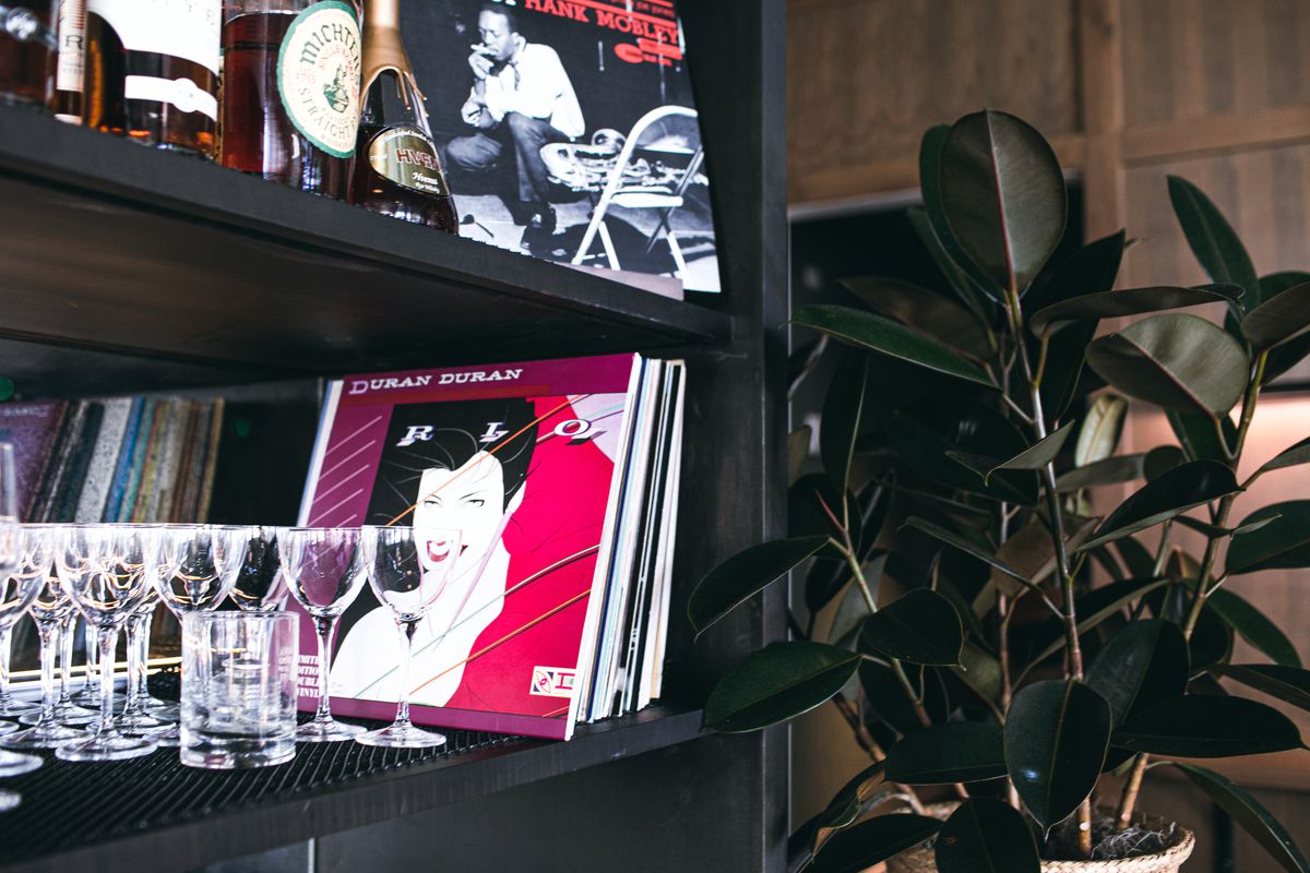 Records like Duran Duran’s “Rio” and Frank Mobley are stacked on the shelves along the back bar among the glasses and liquor bottles at Lyla Lila in Midtown.