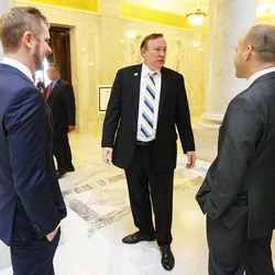 Sen. Jim Dabakis, center, talks with Equality Utah's Executive Director Troy Williams and Board Chairman Clifford Rosky prior to a press conference at the state Capitol in Salt Lake City  Tuesday, Jan. 27, 2015. 