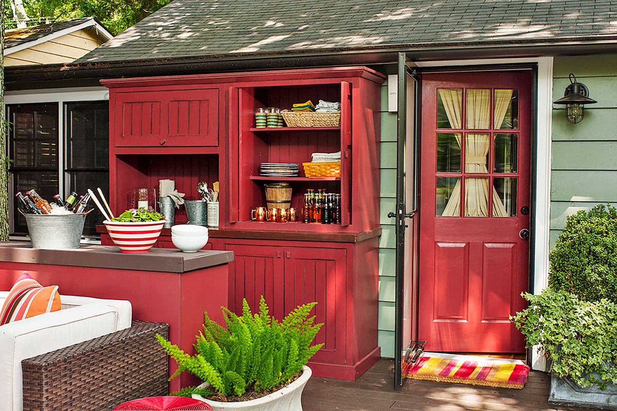 Red custom cabinets in backyard