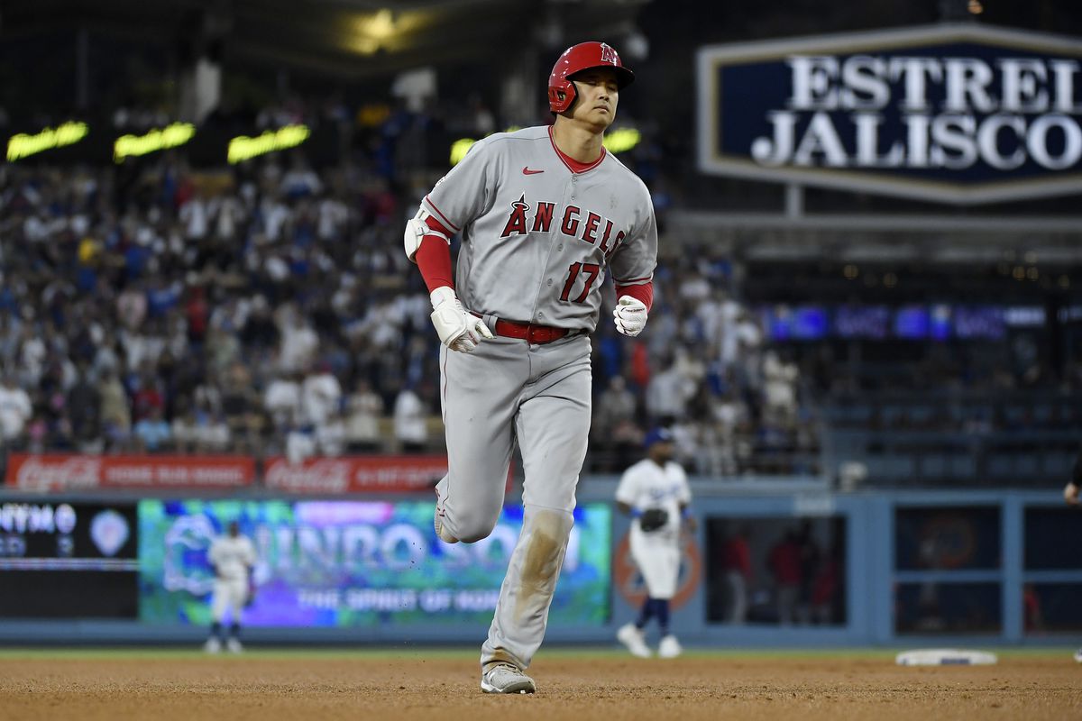 Shohei Ohtani of the Los Angeles Angels runs the bases after hitting a two run homer un to score Andrew Velazquez against pitcher pitcher Michael Grove of the Los Angeles Dodgers during the seventh inning at Dodger Stadium on July 8, 2023 in Los Angeles, California.