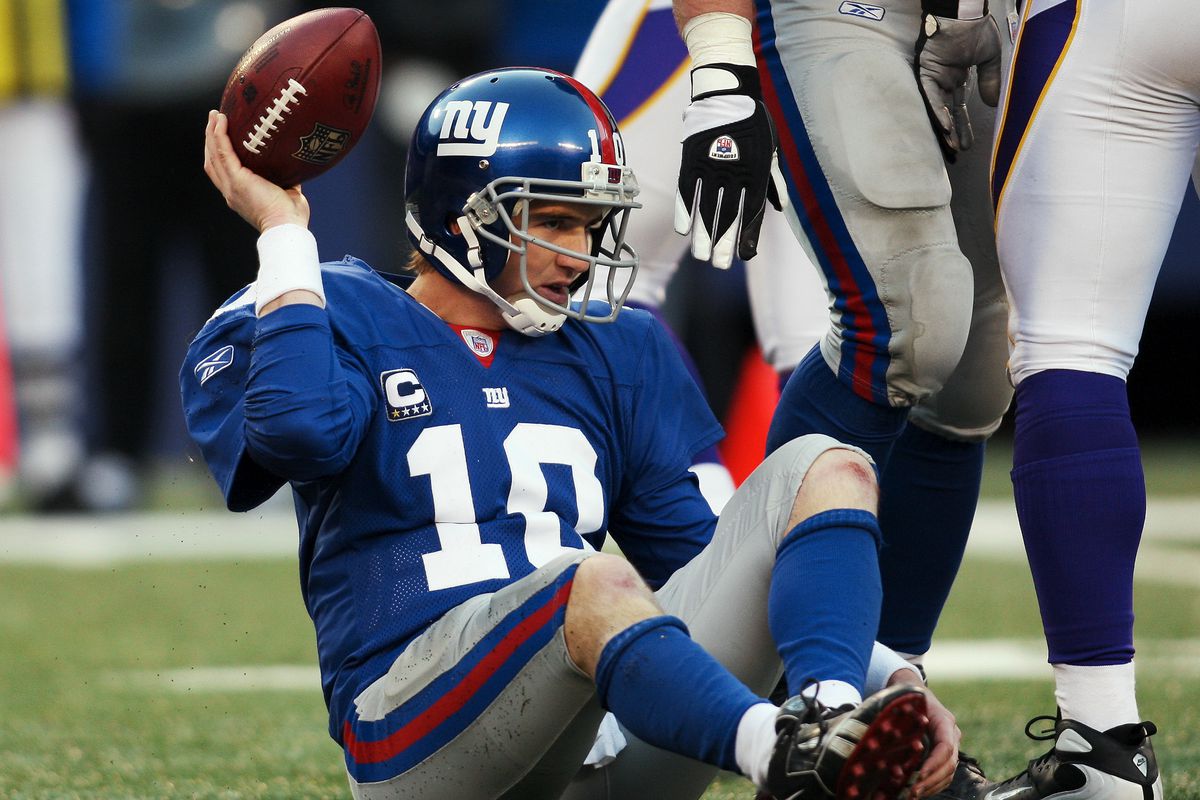 Eli Manning gives up the ball after being sacked in the seco