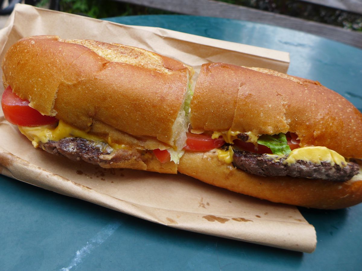 A pair of patties on a baguette.
