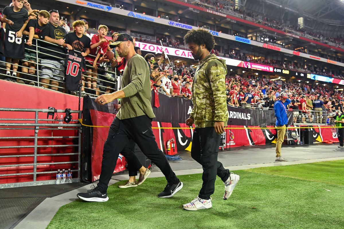 Kyler Murray #1 of the Arizona Cardinals (R) leaves the field after the game against the Carolina Panthers at State Farm Stadium on November 14, 2021 in Glendale, Arizona.
