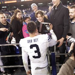 Brigham Young Cougars linebacker Kyle Van Noy (3) gives his mother Kelly his defensive MVP trophy after the Poinsettia Bowl in San Diego  Thursday, Dec. 20, 2012.   BYU beat San Diego 23-6. 