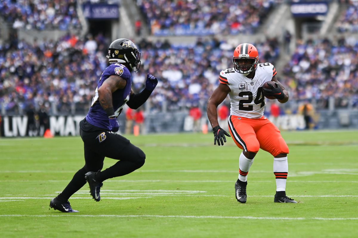 Cleveland Browns running back Nick Chubb (24) rushes as Baltimore Ravens safety Geno Stone (26) defends during the first half at M&amp;amp;T Bank Stadium.