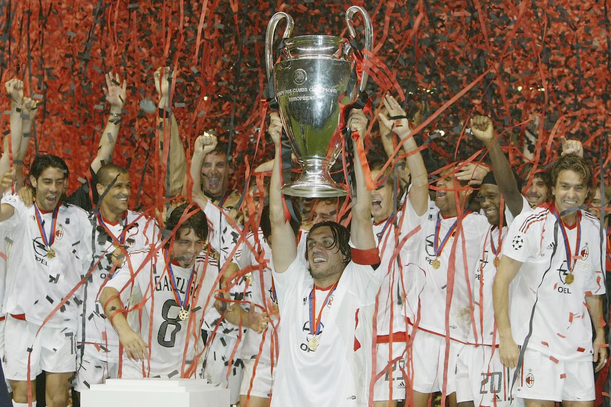 The captain, Paolo Maldini, lifting the trophy after the victory against Juventus.