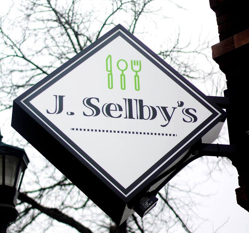 The white sign of J. Selby’s