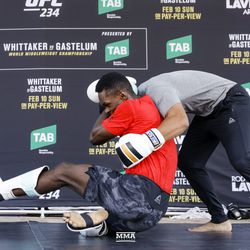 Israel Adesanya shows off his wrestling moves at UFC 234 workouts.