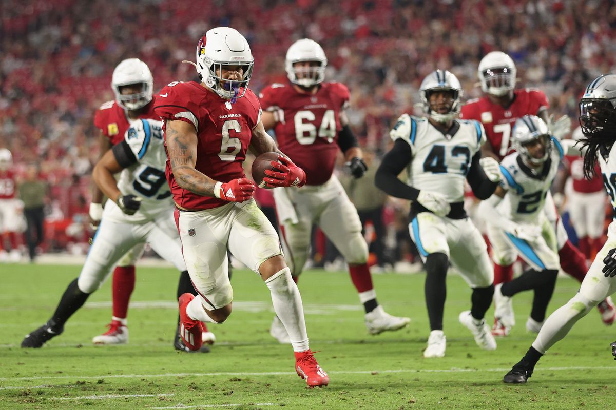 Running back James Conner #6 of the Arizona Cardinals scores on a 11-yard rushing touchdown against the Carolina Panthers during the fourth quarter of the NFL game at State Farm Stadium on November 14, 2021 in Glendale, Arizona.