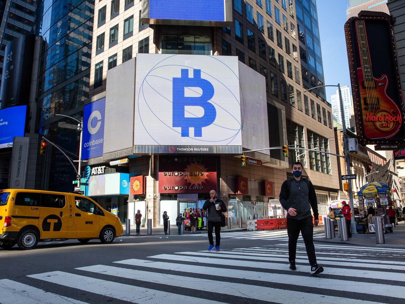 A digital sign outside the Nasdaq building in New York displays a bitcoin symbol that resembles a capital B combined with a dollar sign.