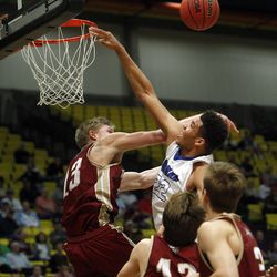 Bingham's Yoeli Childs (22) has a shot blocked by Viewmont's Ben Barrett (13), in the first round of the 5A boys basketball tournament against Viewmont at the UCCU Events Center in Orem, Tuesday, March 1, 2016.