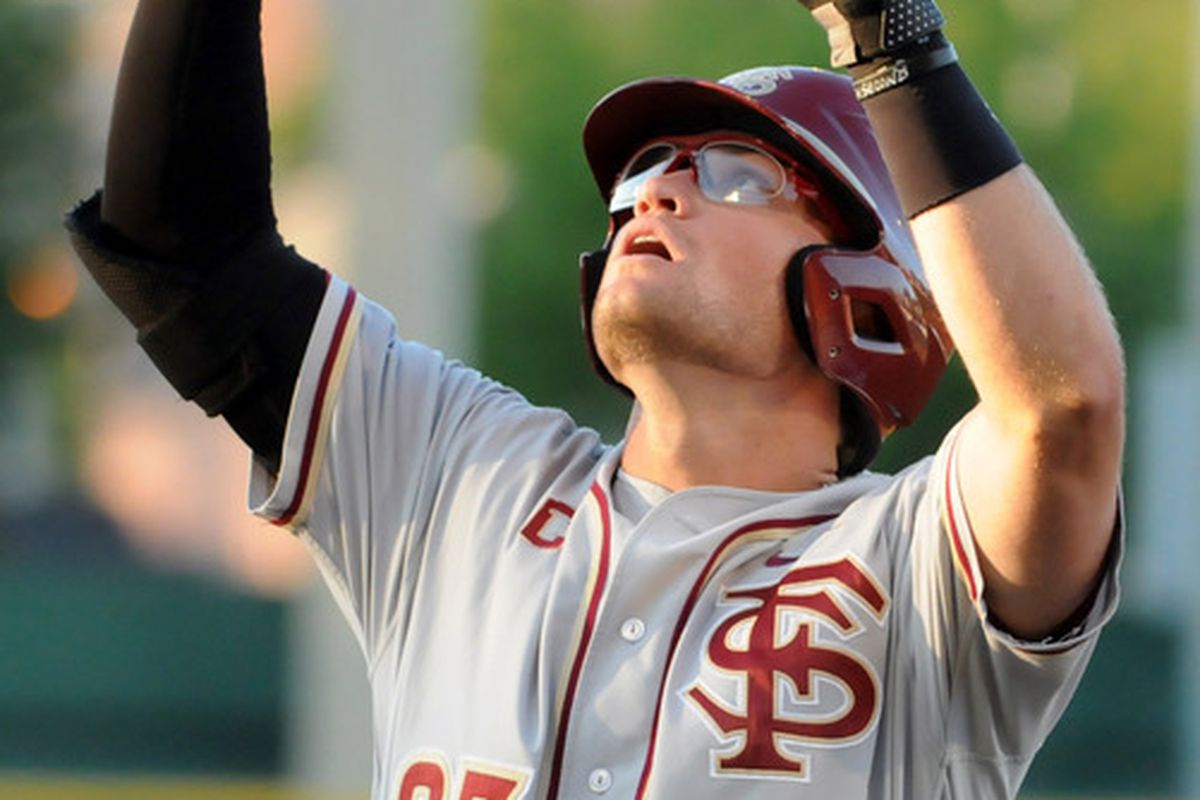 June 2, 2012; Tallahassee, FL, USA; Florida State Seminoles outfielder James Ramsey (23) celebrates after a hit in the second inning in game four of the Tallahassee regional at Dick Howser Stadium.  Mandatory Credit: Melina Vastola-US PRESSWIRE