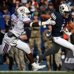 Brigham Young Cougars wide receiver Moroni Laulu-Pututau runs the ball during a game against the UMass Minutemen at LaVell Edwards Stadium in Provo on Saturday, Nov. 19, 2016.